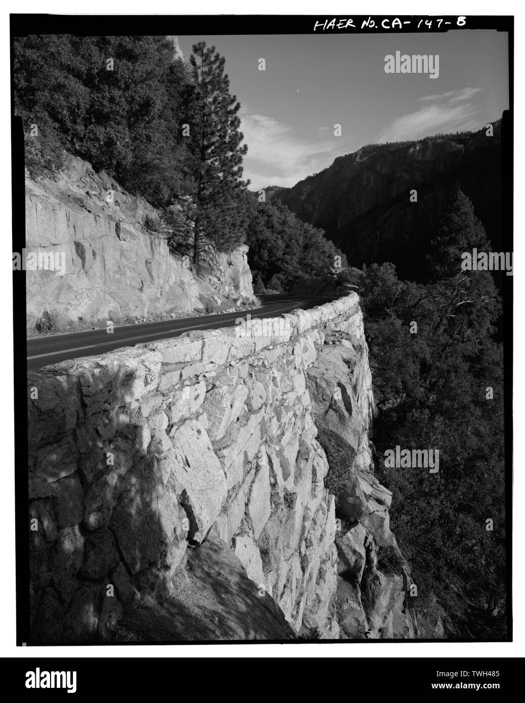 Retaining wall, .6 mi. west of tunnel -3, view facing SE. - Big Oak Flat Road, Between Big Oak Flat Entrance and Merced River, Yosemite Village, Mariposa County, CA Stock Photo