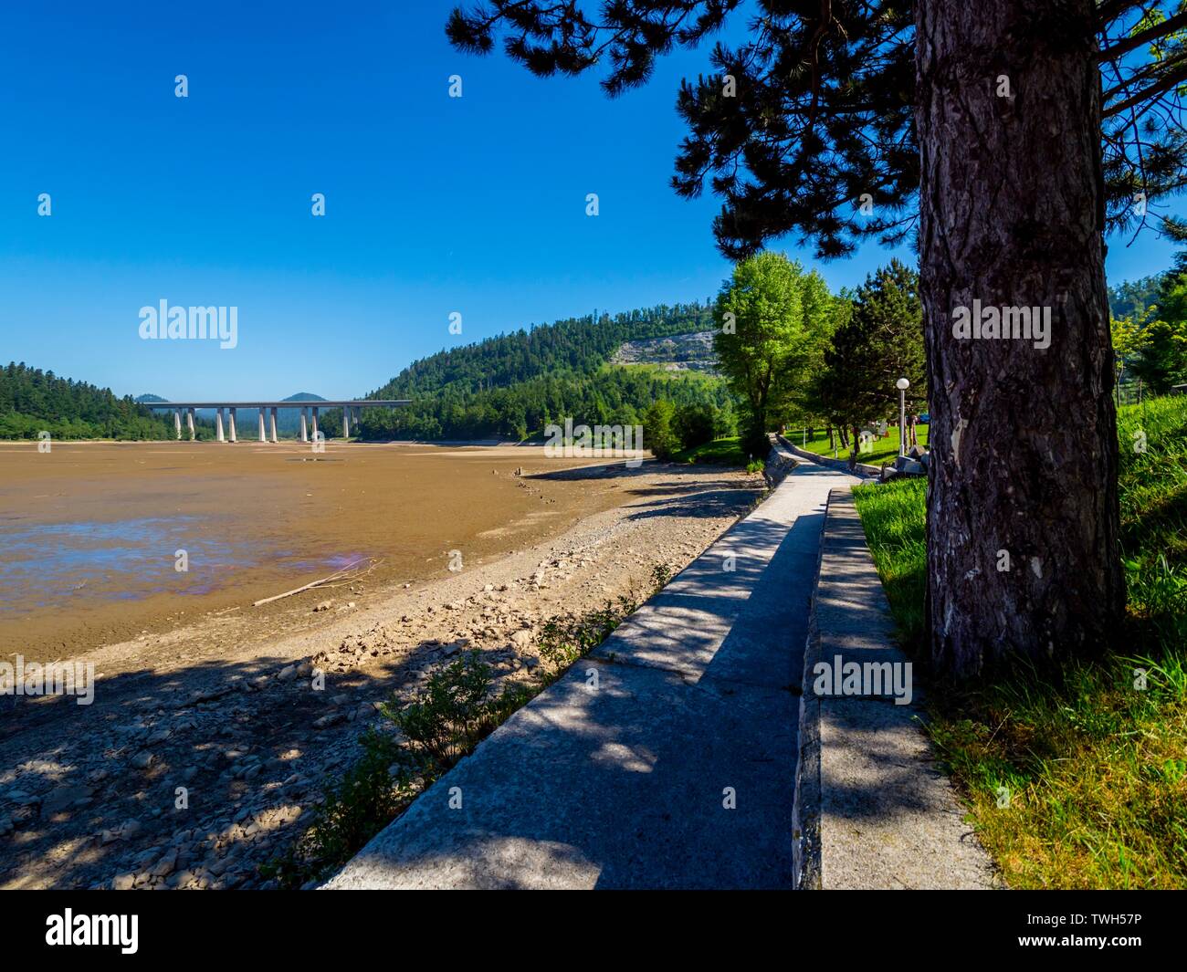 Dried lake-bed Bajer in Fuzine Croatia Spring 2019 coastline promenade Stock Photo