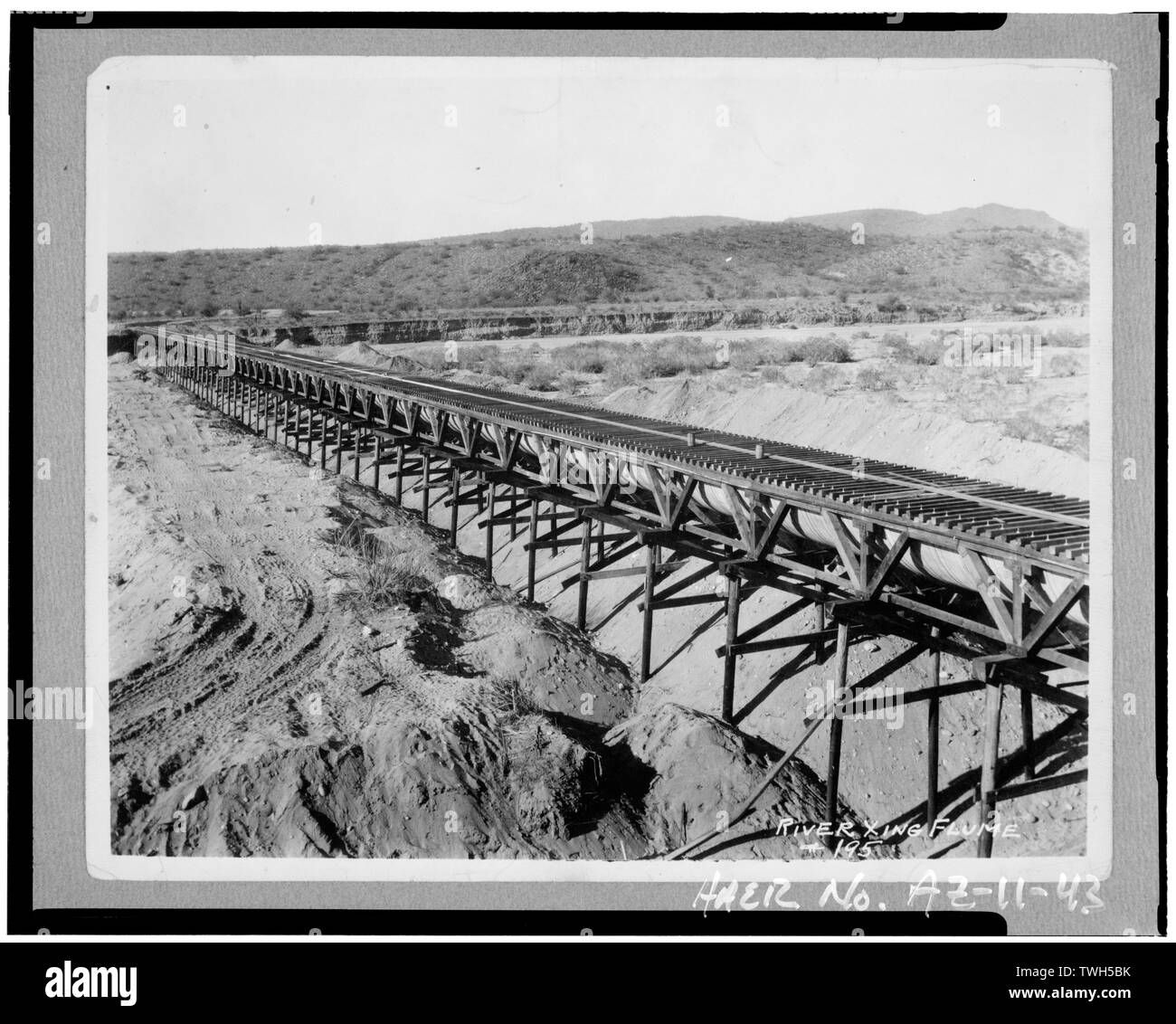 River Crossing Flume carrying canal water west across the Agua Fria River approximately four miles downstream from Pleasant Dam. Photographer unknown, c. late 1920s. Source- Nancy Bunch - Waddell Dam, On Agua Fria River, 35 miles northwest of Phoenix, Phoenix, Maricopa County, AZ Stock Photo