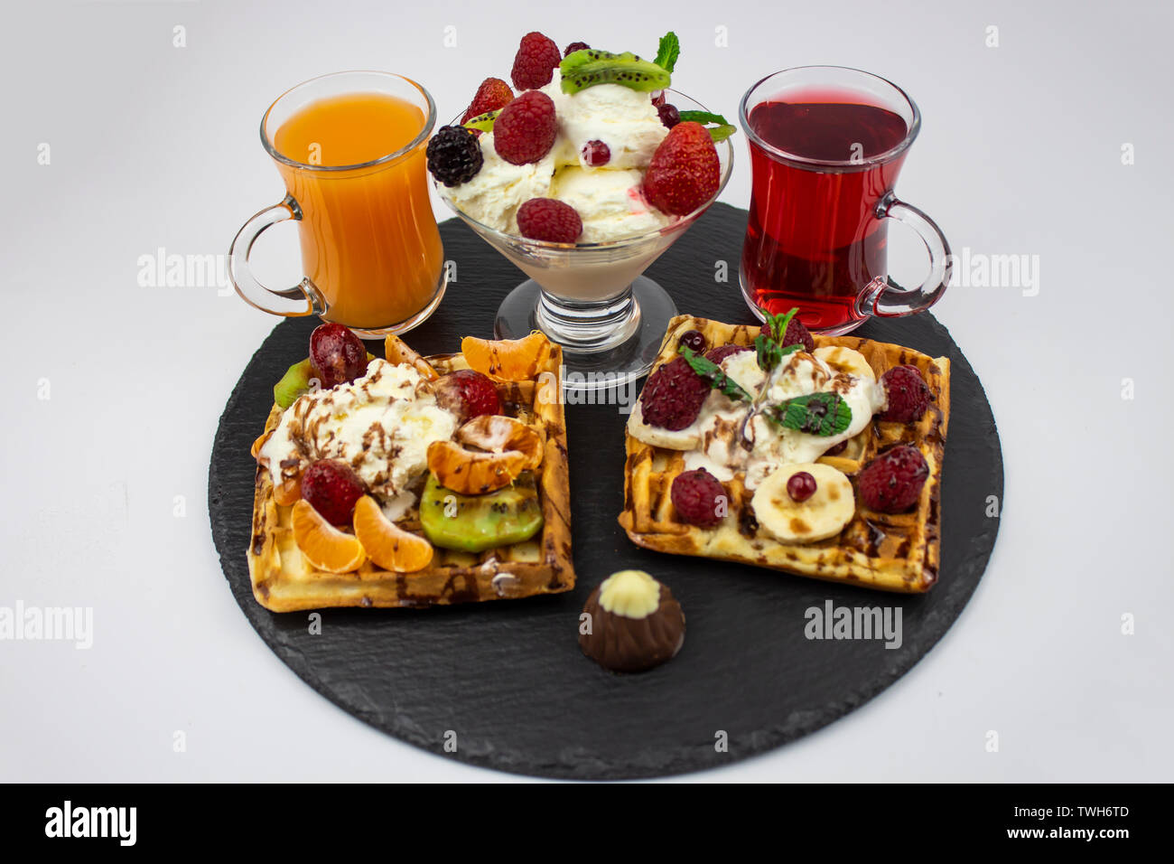 Colorful menu. waffles, ice cream, juice and berries. The concept of