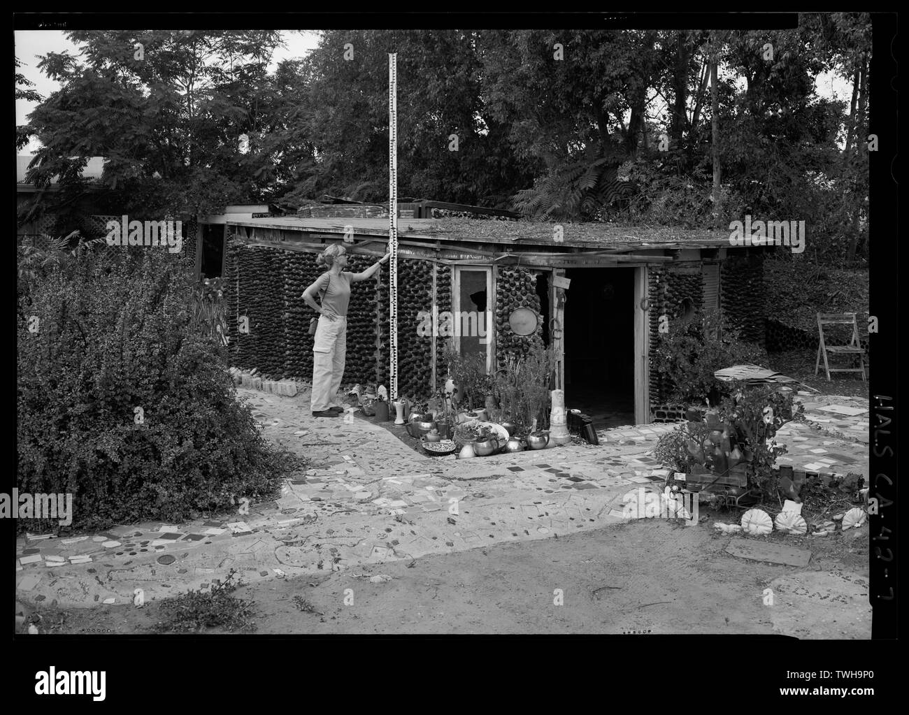 Round House front facade oblique with 12' scale (in tenths). Structure is 24' in diameter and has a sunken floor. Camera facing northeast. - Grandma Prisbrey's Bottle Village, 4595 Cochran Street, Simi Valley, Ventura County, CA Stock Photo