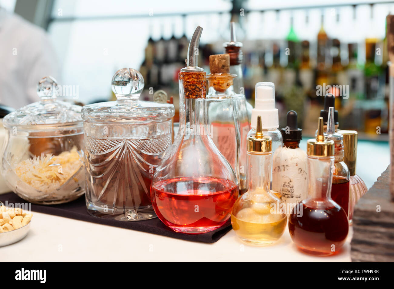 Bitters, spices and infusions on bar counter Stock Photo