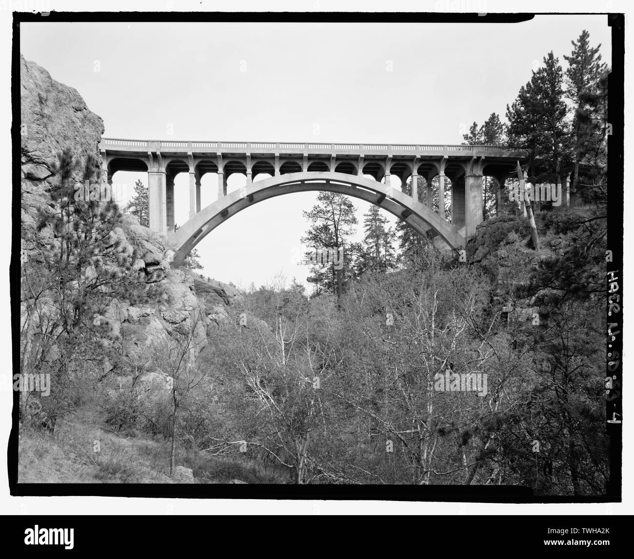 Route 87, Beaver Creek Bridge, elevation. View ESE. - Beaver Creek Bridge, Hot Springs, Fall River County, SD; Hamilton, J Harper; Northwestern Engineering Company; Adelstein, Morris E; Linder, Jack A; Gray, Chris, field team project manager; Magdalenos, Christine, landscape architect; Marston, Christopher, project manager; Christianson, Justine, transmitter; Davis, Tim, historian; Delyea, Todd, delineator; Grinstead, Tim, delineator; Heckaman, Stacey, delineator; Michel, Roger, delineator; Tichi, Claire, historian; Haas, David, photographer Stock Photo