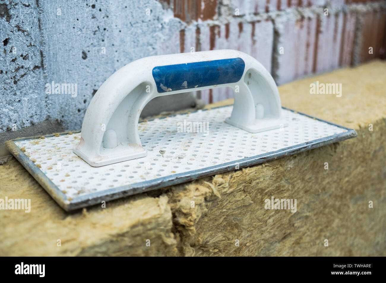 Spreading trowel on the rock wool insulation panels Stock Photo Alamy