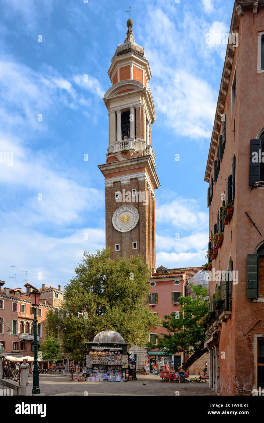 The tower of the Chiesa Cattolica Parrocchiale dei Santi Apostoli in the Cannaregio part of Venice on a summer morning Stock Photo
