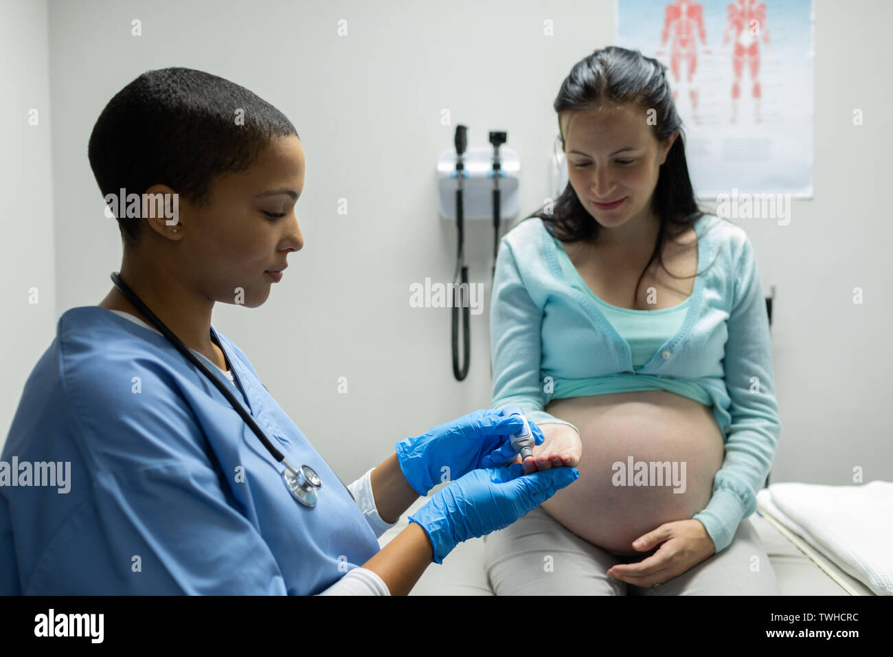 Doctor checking blood sugar of pregnant woman Stock Photo Alamy