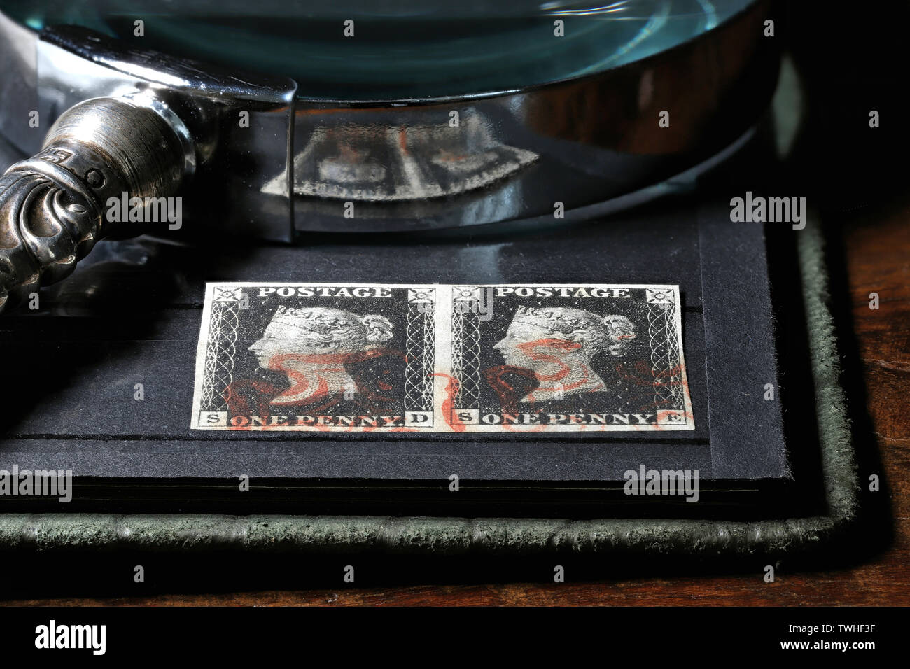 Horizontal pair of plate 1b Penny Black with red Maltese cross cancellation. It is the world's first adhesive postage stamp. Stock Photo