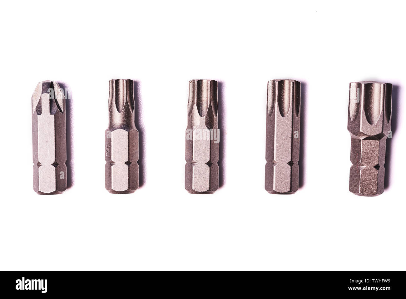 five bits for screwdriver isolated on white background. Stock Photo
