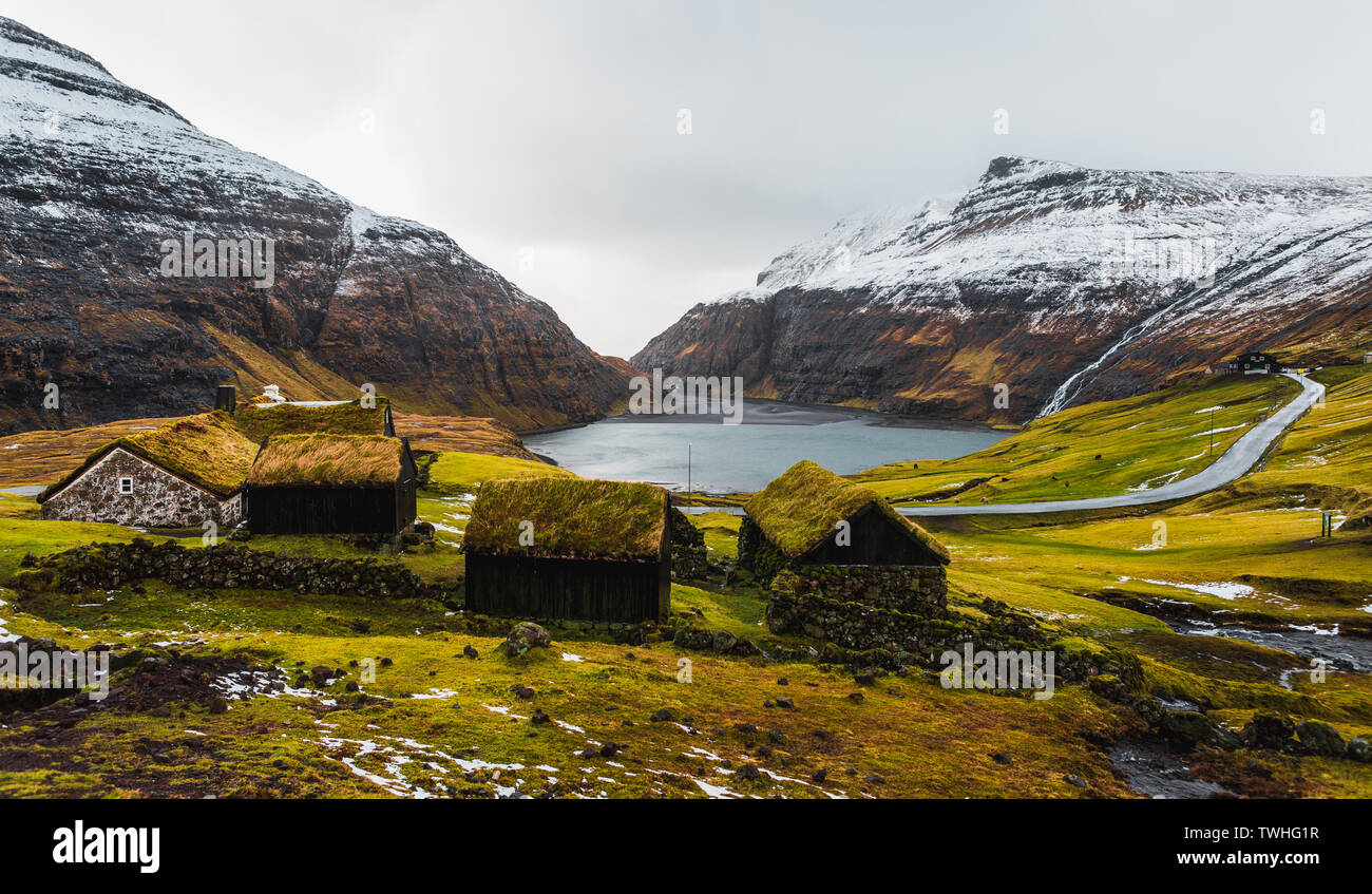 Panorama View Of Typical Faroese Grass Covered Cabins In The Small