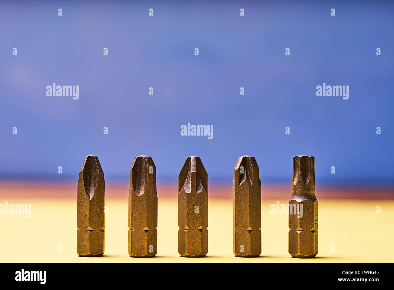 Bits for screwdrivers on a colored background. Stock Photo