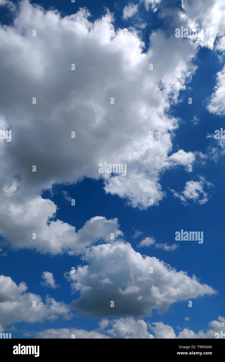 Deep blue sky and fluffy white clouds Stock Photo