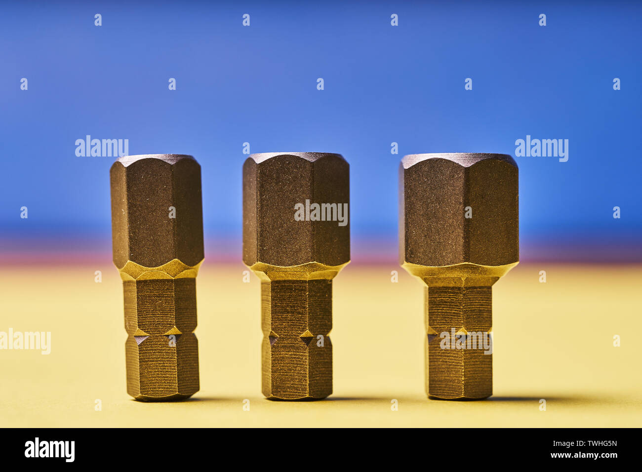 Bits for screwdrivers on a colored background. Stock Photo