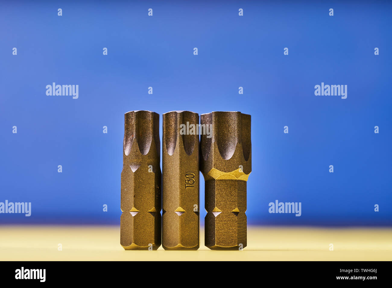 Bits for screwdrivers on a colored background. Stock Photo