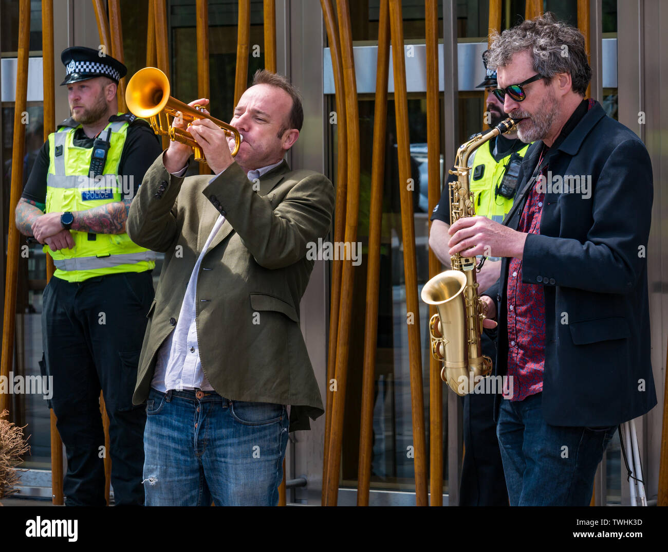 Extinction Rebellion Climate Change protest trumpet & saxophone players jazz music, Scottish Parliament, Edinburgh, Scotland, UK Stock Photo