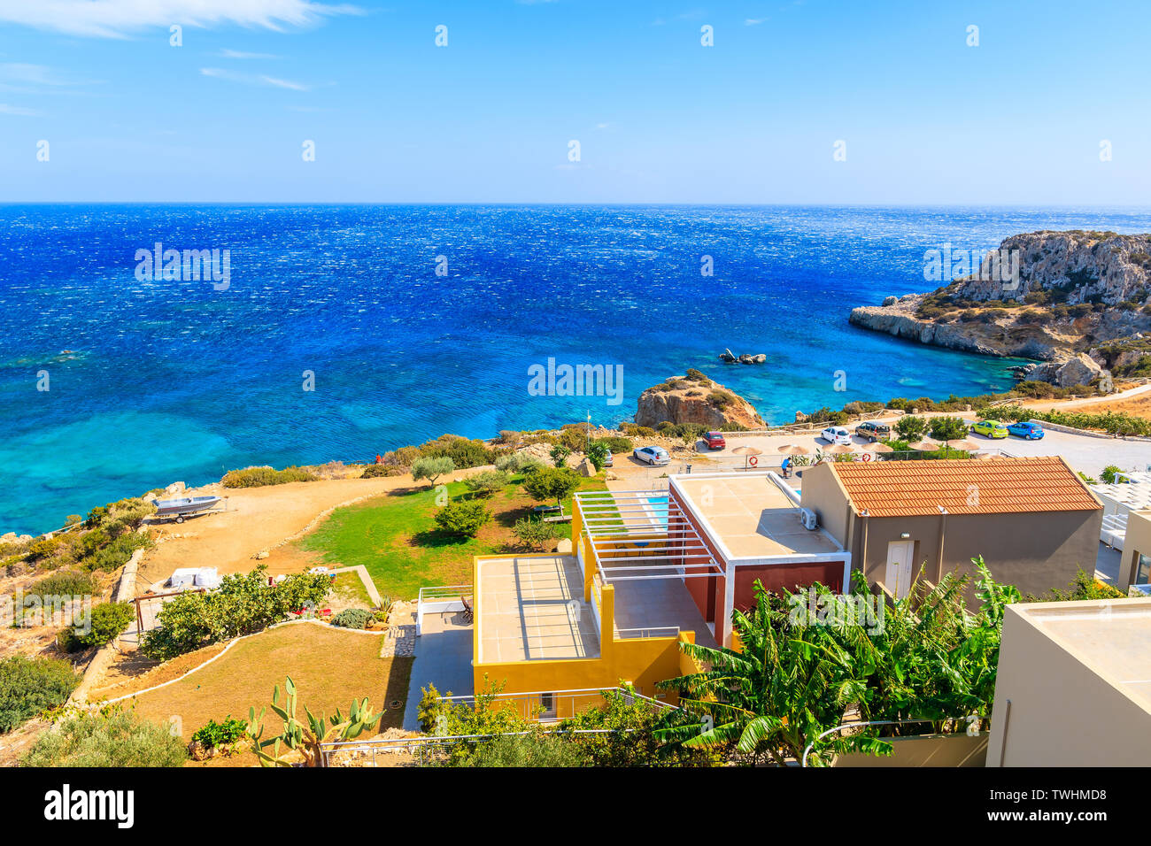 Colorful houses on sea coast of Karpathos island near Ammopi village, Greece Stock Photo