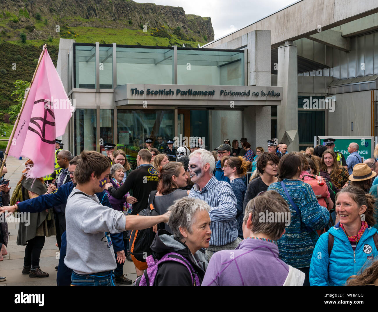 Extinction Rebellion Climate Change protestors in theatrical dancing mass die-in, Scottish Parliament, Edinburgh, Scotland, UK Stock Photo