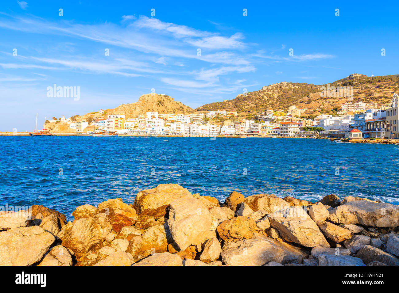 View of picturesque Pigadia port on Karpathos island at sunset time, Greece Stock Photo