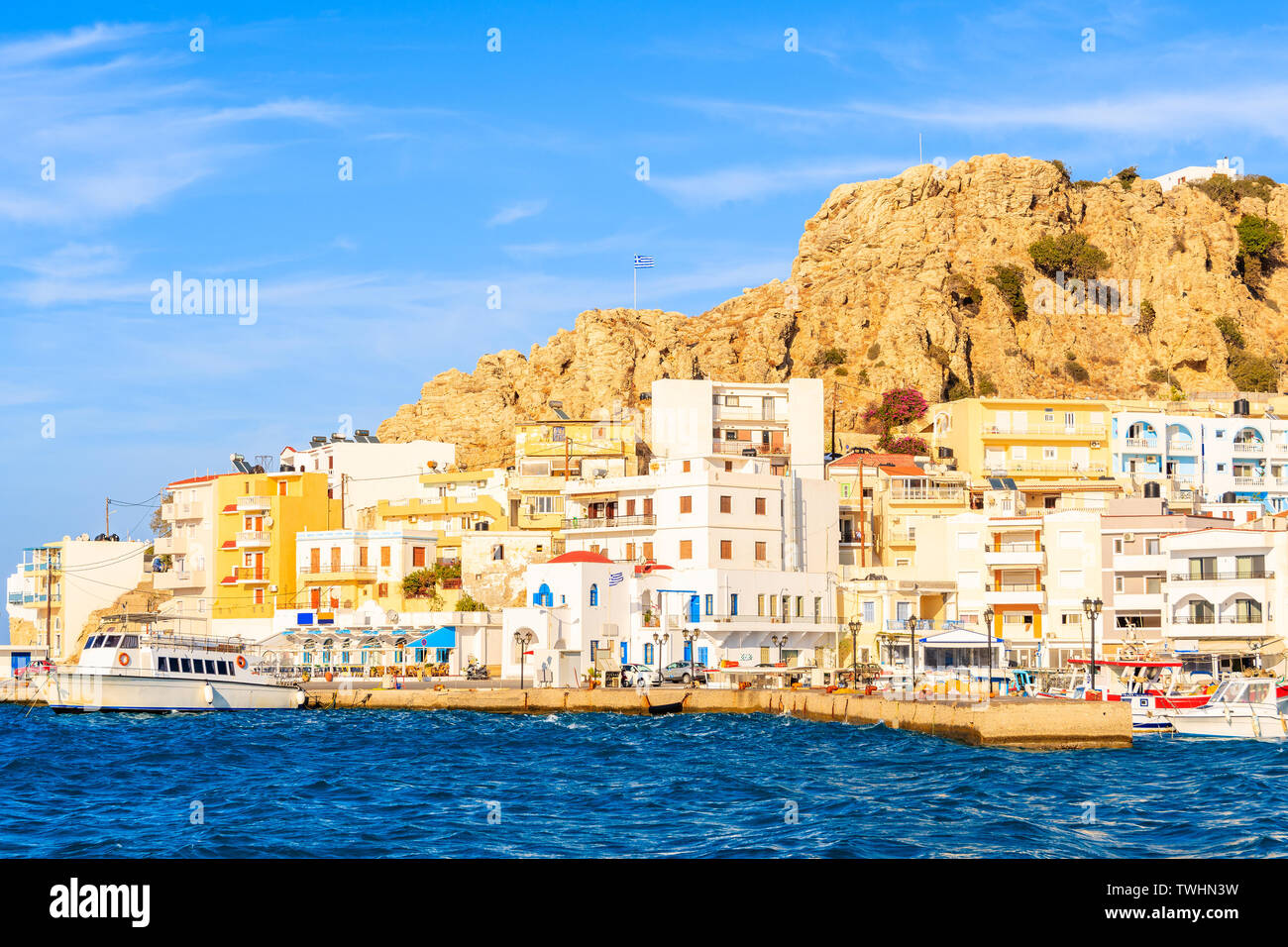 View of picturesque Pigadia port on Karpathos island at sunset time, Greece Stock Photo