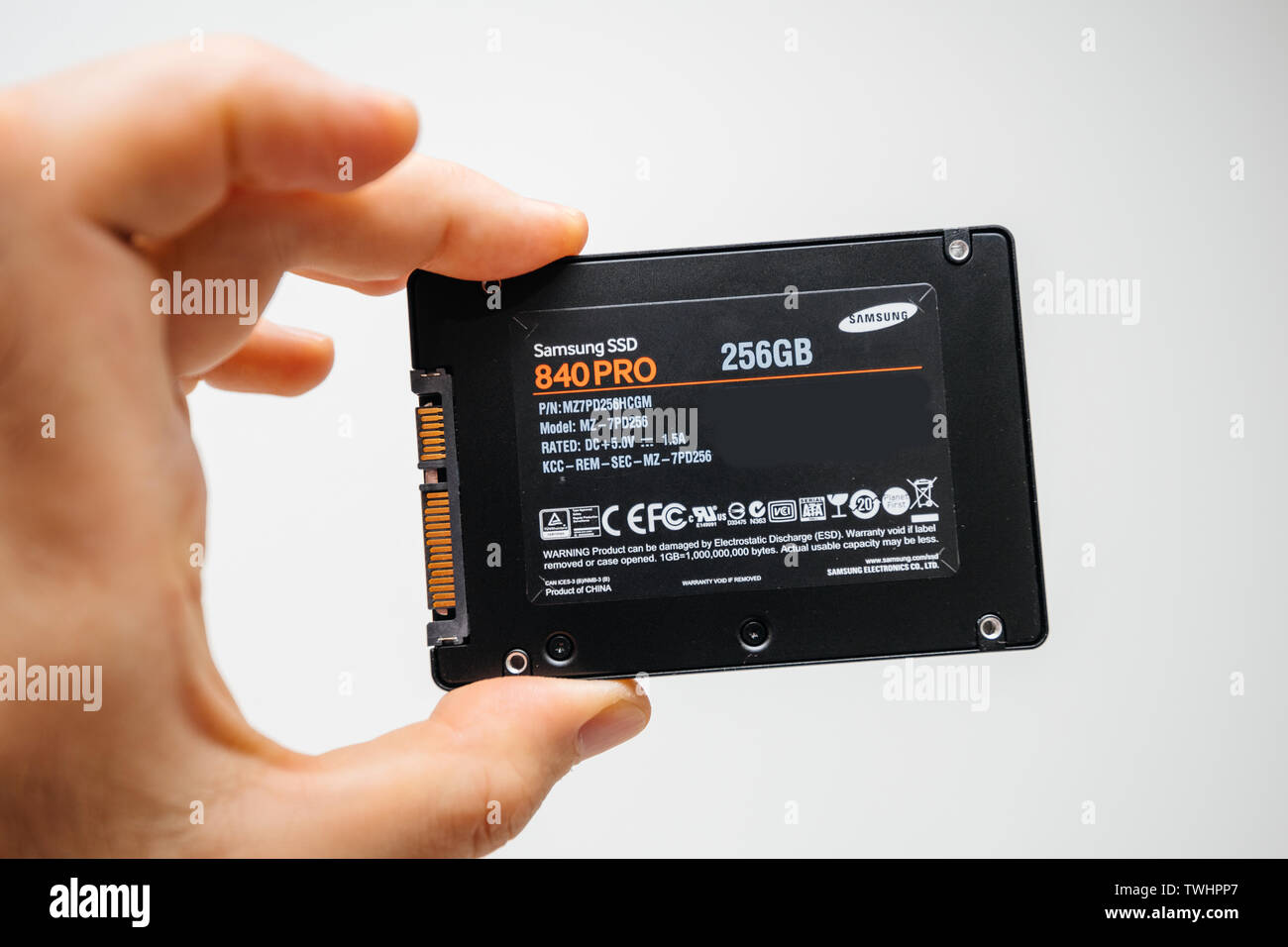 Paris, France - May 18, 2019: man hand holding new SSD Solid state drive  disk from Samsung model 840 EVO 256gb fastest flash media disk - white  background Stock Photo - Alamy