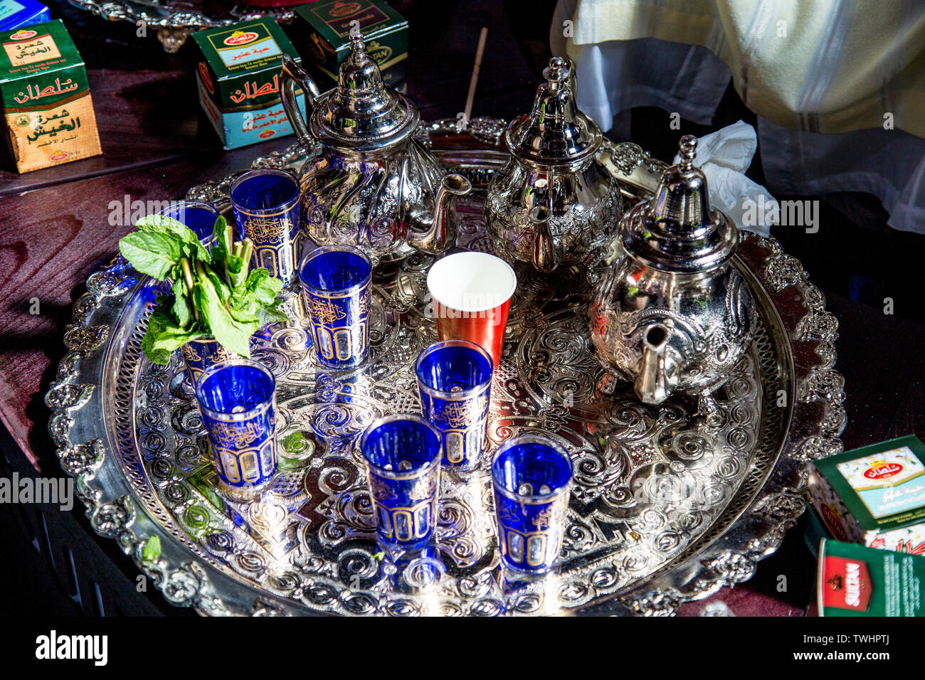 Traditional silverware used for Moroccan mint tea, pots, ornate glasses and tray, FesTeaVal 2019 at Tobacco Dock, London, UK Stock Photo