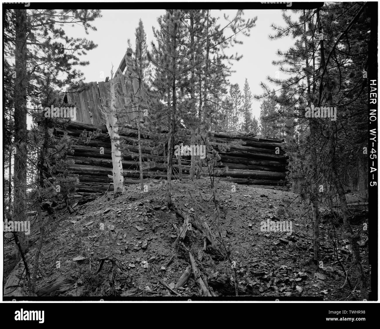 SHAFT HOUSE, EAST ELEVATION; VIEW TO THE NORTHWEST; (WASTE ROCK-SPOIL PILE IN THE FOREGROUND). - Joker Mine, Shafthouse, Medicine Bow National Forest, Northwest of Keystone, Keystone, Albany County, WY; Oneida Mining Company Stock Photo