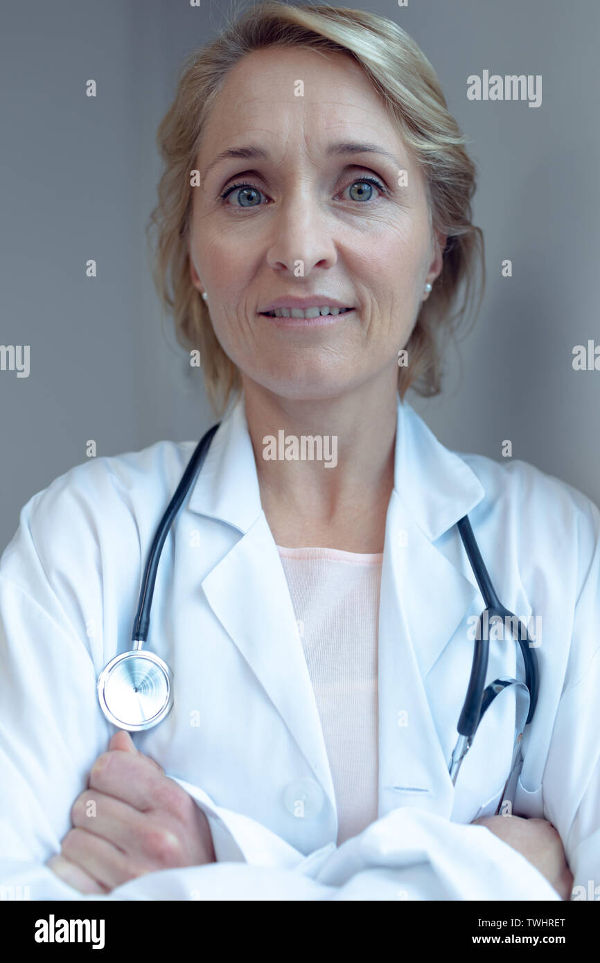Senior female doctor arms crossed hi-res stock photography and images ...
