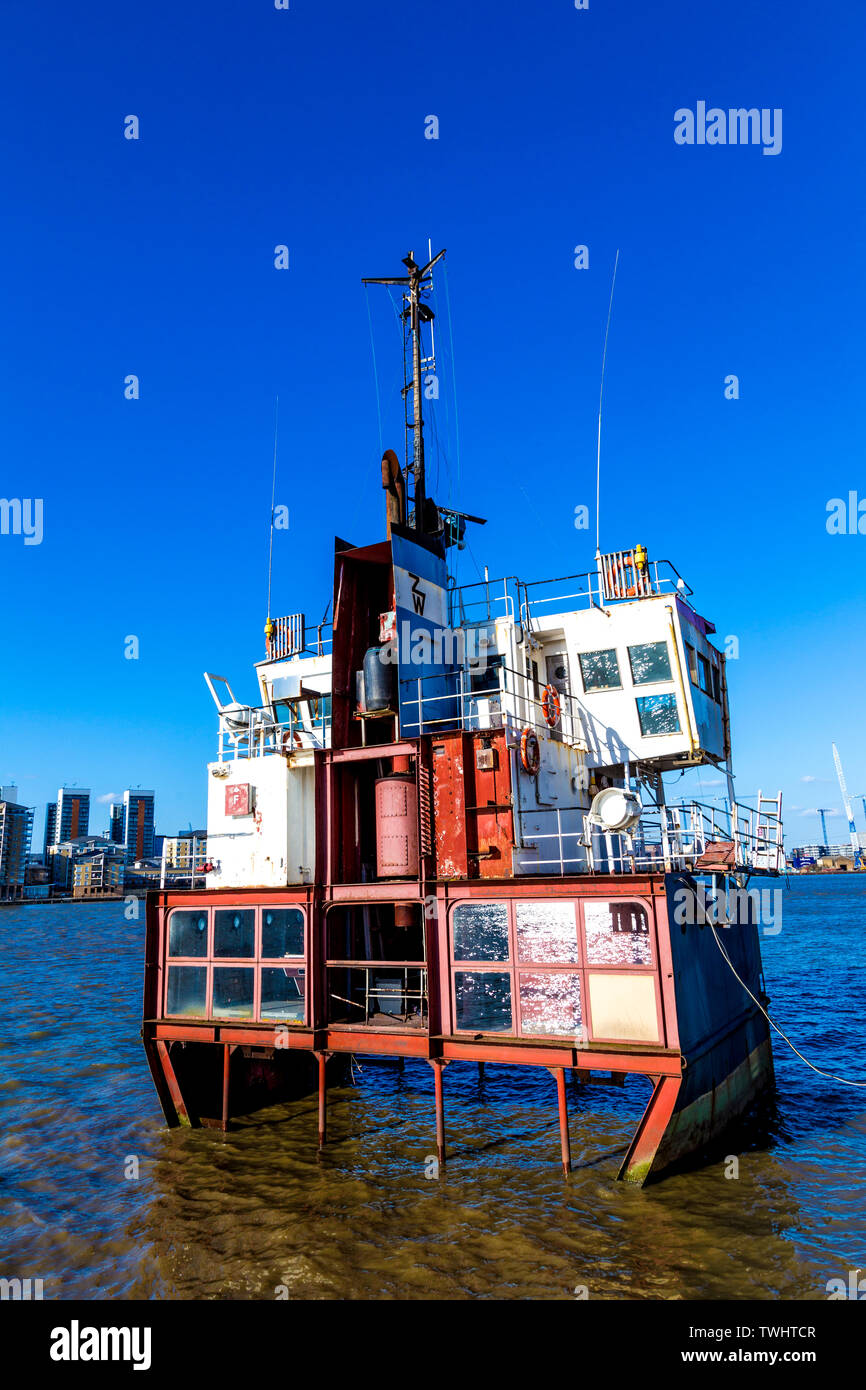 'A Slice of Reality' (2000) by Richard Wilson, a sliced section of a Sand Dredger, part of The Line Art Walk, Greenwich, London, UK Stock Photo