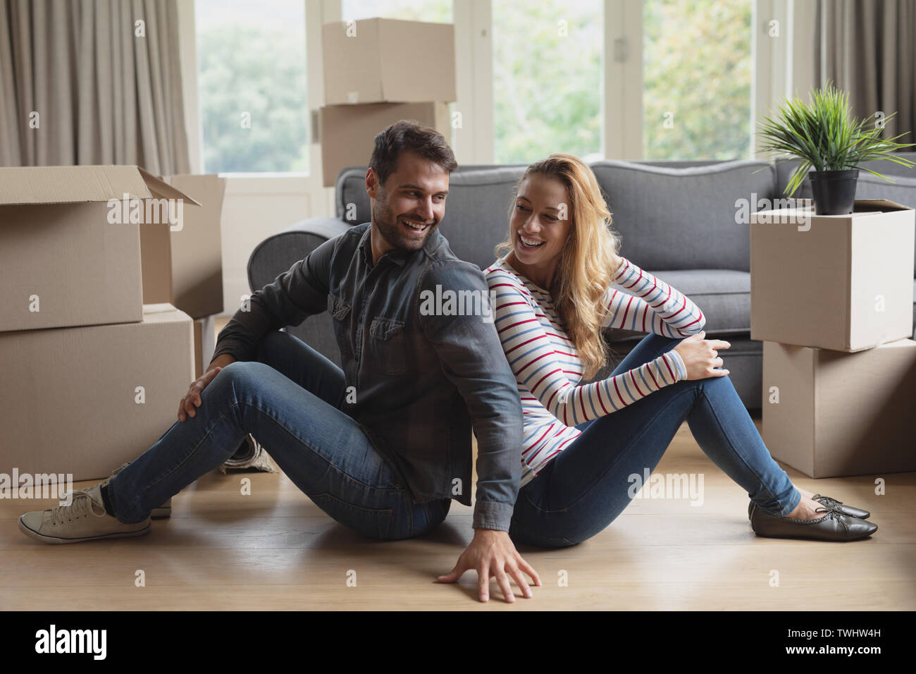 Beautiful young man sitting hi-res stock photography and images - Alamy