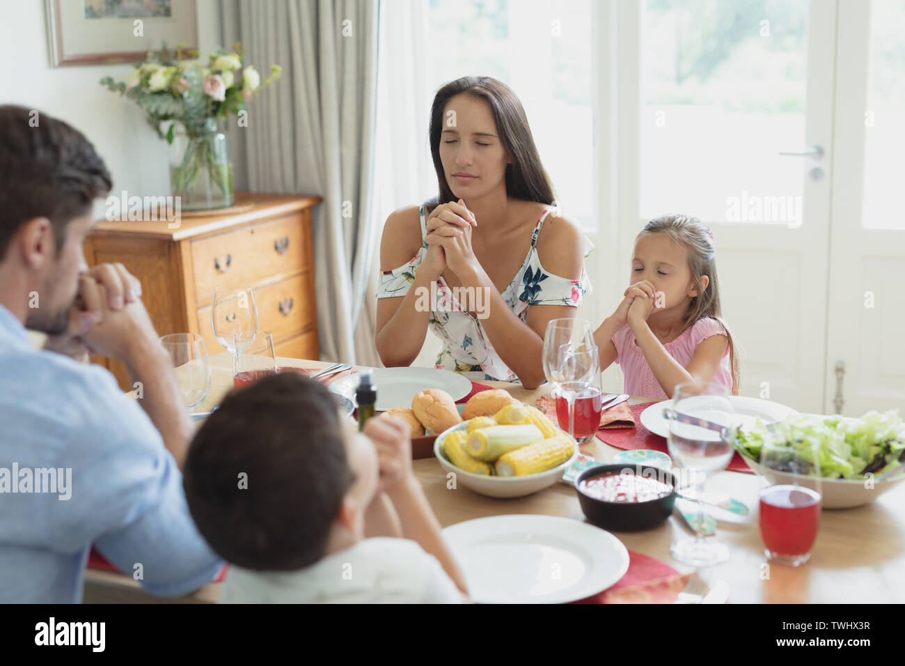 Adult child praying together hi-res stock photography and images - Alamy