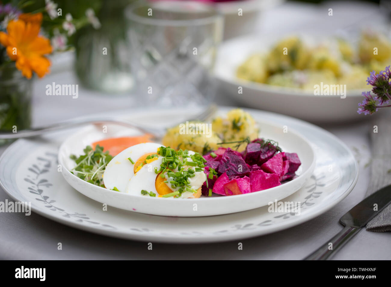 Scandinavian midsummer feast with potato salad, salmon and beetroot Stock Photo