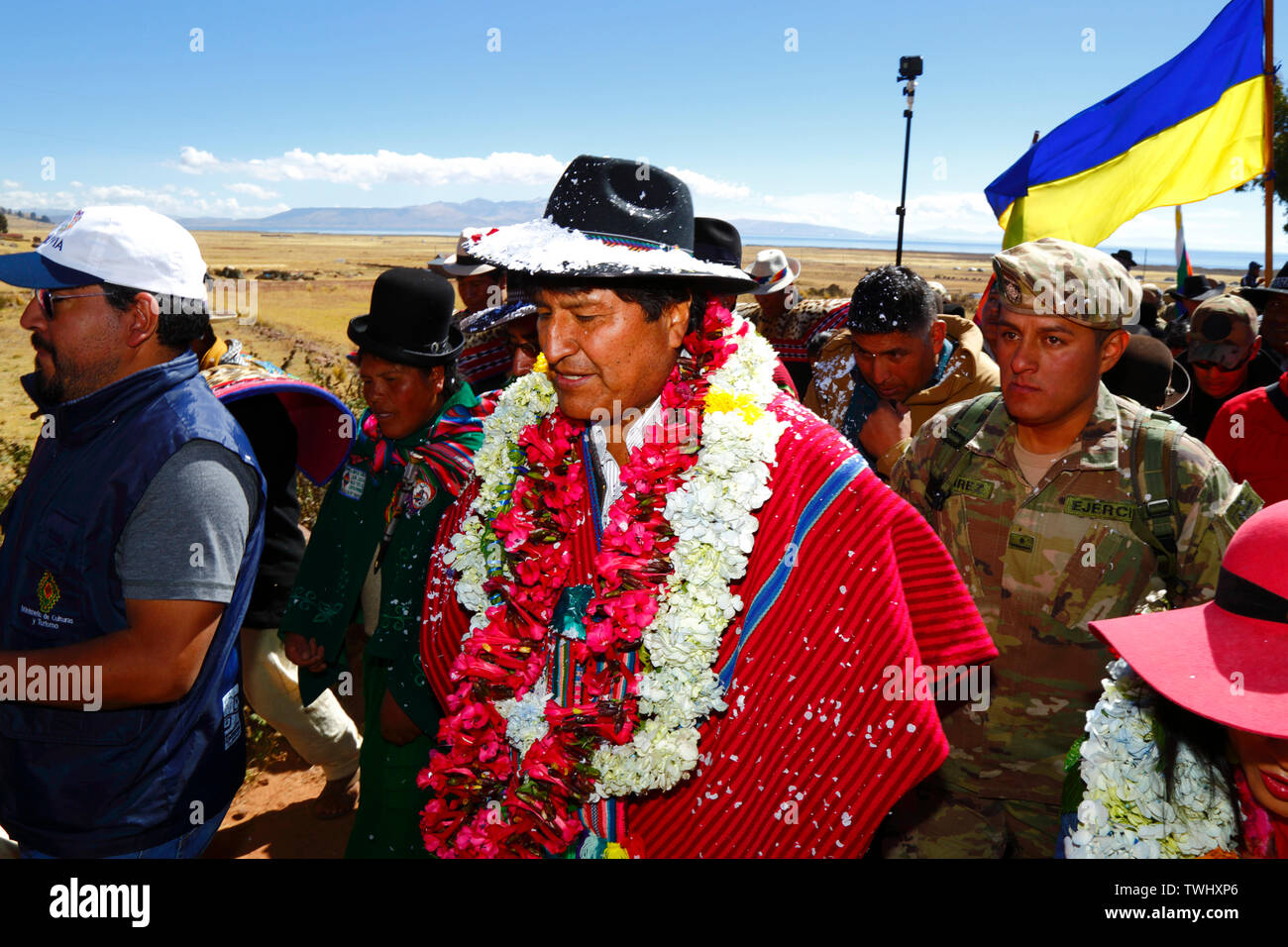 Bolivia 20th June 2019: Bolivian president Evo Morales Ayma (centre) leads an International Hike along a section of the Qhapaq Ñan Inca road from Azafranal near Lake Titicaca (which is visible in the background). The event was organised by the Ministry of Cultures & Tourism to promote tourism and Bolivia's indigenous cultures. Stock Photo