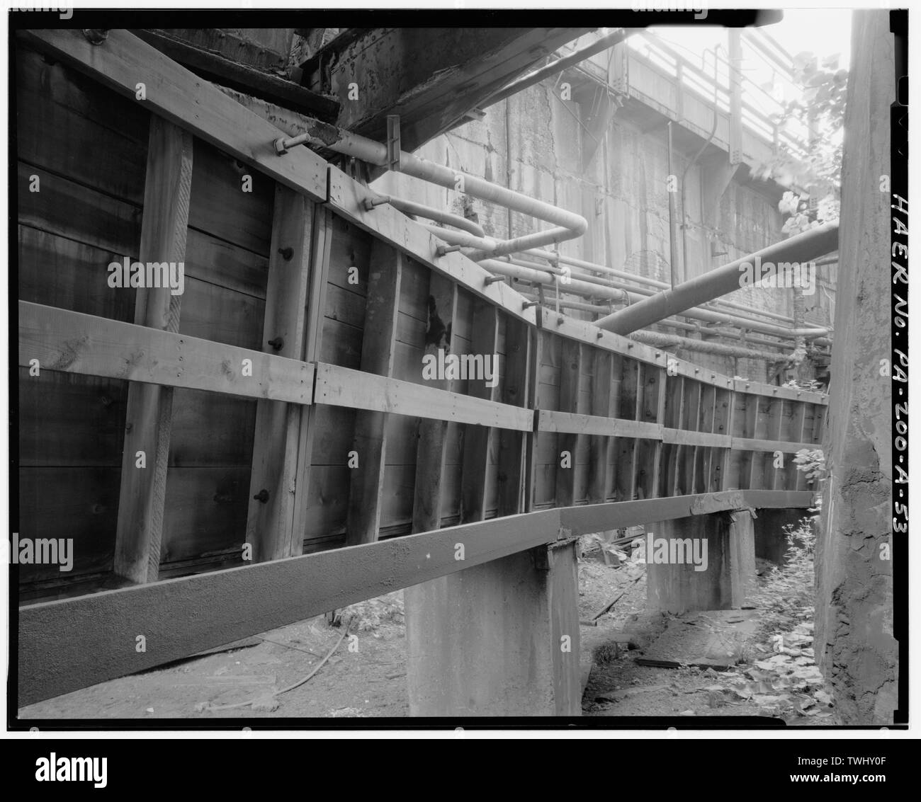 SIDE VIEW OF GRANULATED SLAG FLUME FOR CARRIE No. 6. - U.S. Steel Homestead Works, Blast Furnace Plant, Along Monongahela River, Homestead, Allegheny County, PA; U.S. Steel Corporation; Brown, James S; Clark, E L; Fownes, H C; Fownes, W C; Brown Hoisting Machinery Company; Massicks and Crooke; Pollock Company; Westinghouse Electric Company; Wilson-Snyder; Allis-Chalmers Company; Keystone Bridge Company; Riley-Stoker; Ingersoll-Rand; S. P. Kinney; Research-Cottrell, Incorporated; Worthington [pump manufacturer]; American Bridge Company; Dravo Engineering Corporation; General Electric Company; S Stock Photo