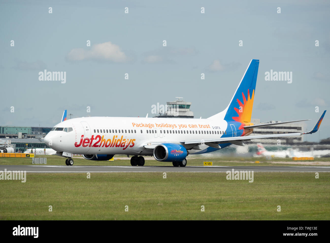 A Jet 2 Holidays Boeing 737 travels down Runway Two at Manchester International Airport in Wilmslow, United Kingdom on Wednesday June 19 2019. Stock Photo