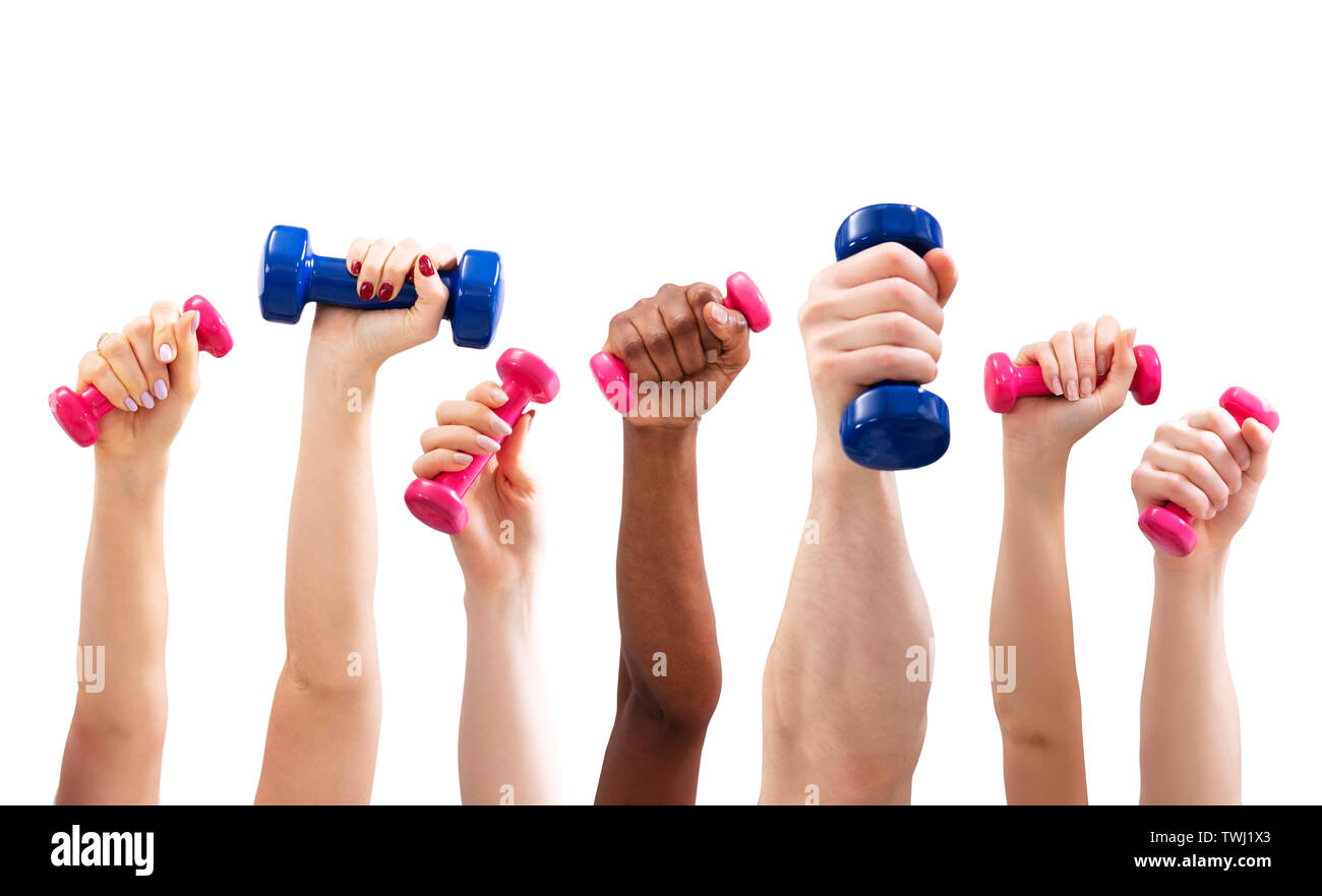 Group Of Man And Woman's Hand Holding Dumbbells In A Row Against White Background Stock Photo