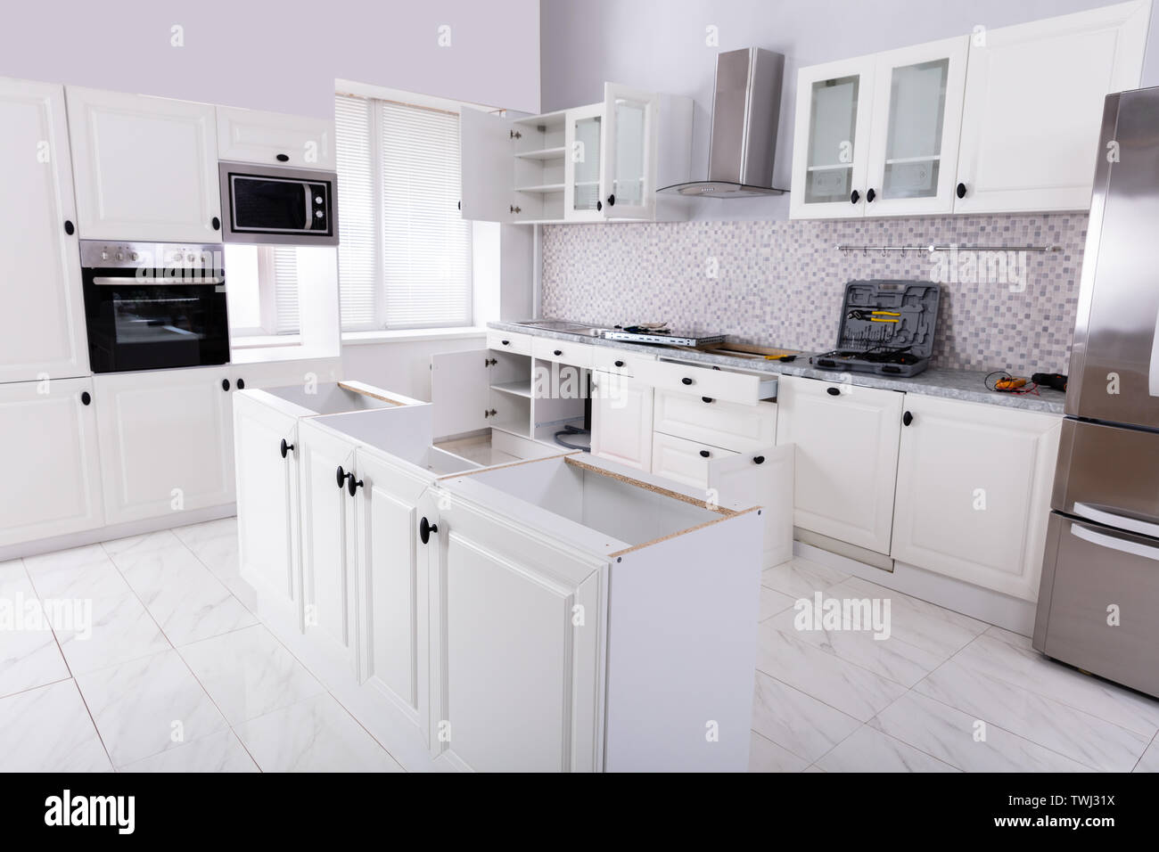 Installation Of Wooden In The White Clean Modular Kitchen Stock Photo Alamy