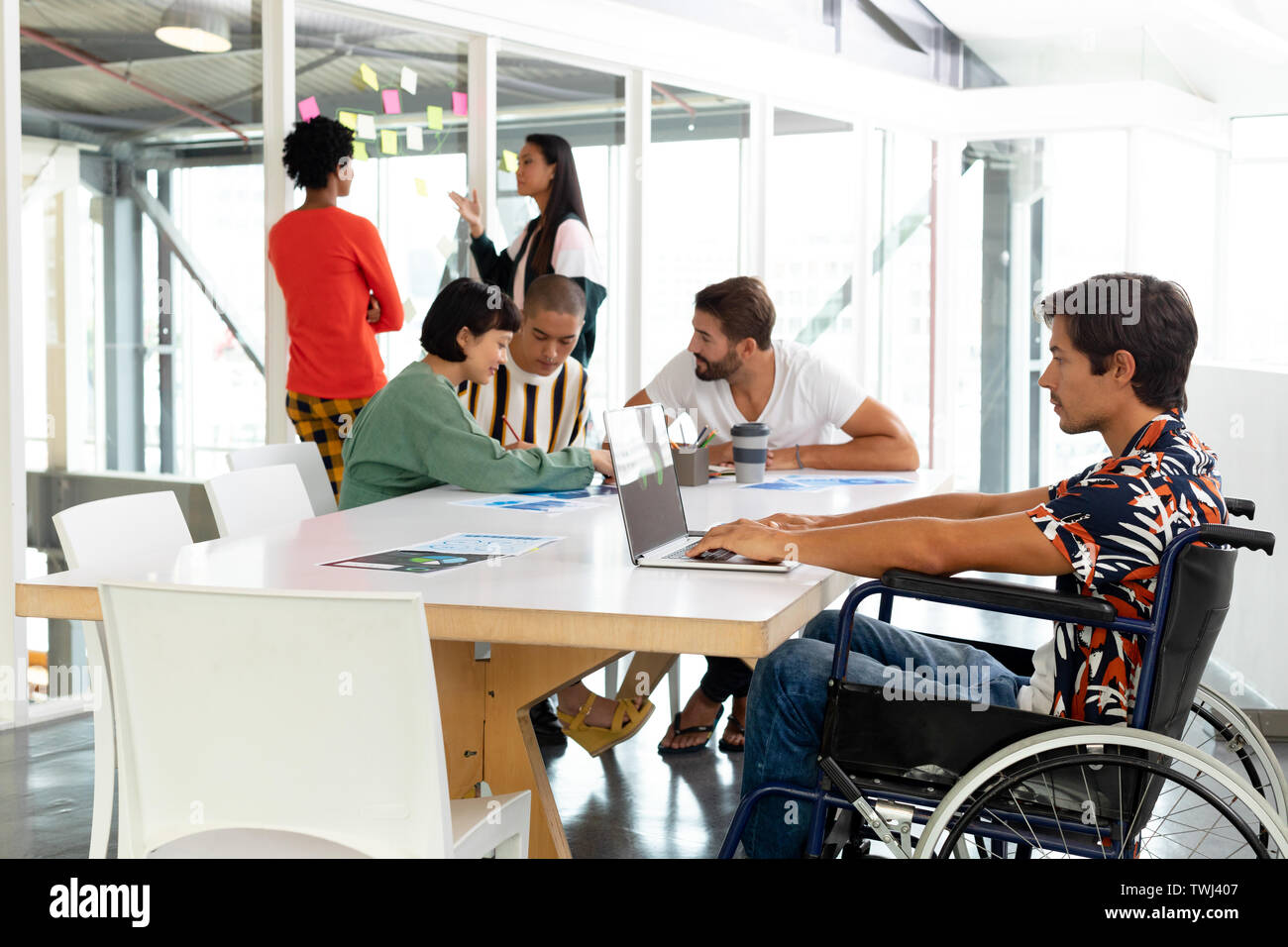 Disabled businessman using laptop in the conference room Stock Photo