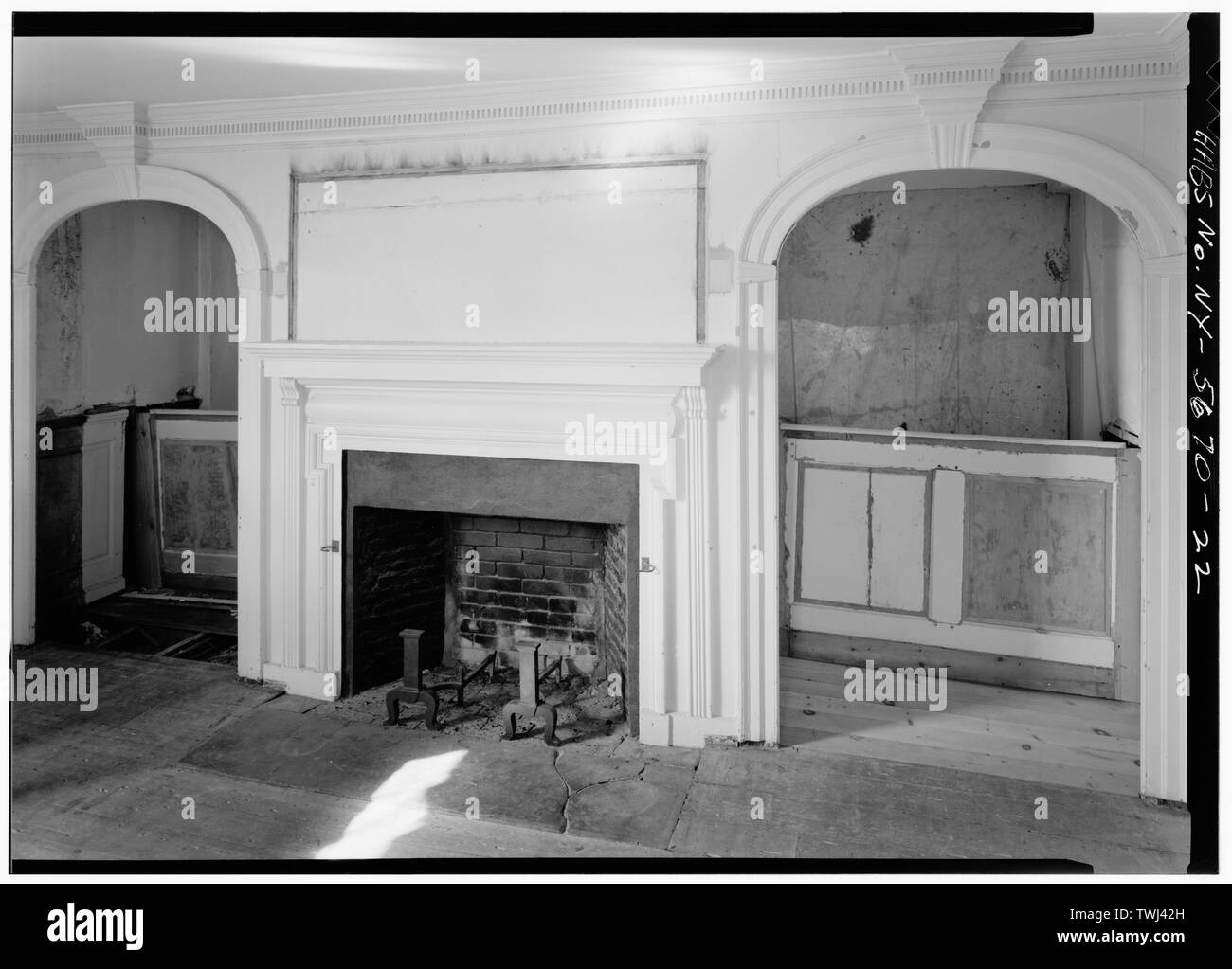 Second floor southwest room with fireplace and arched openings on north