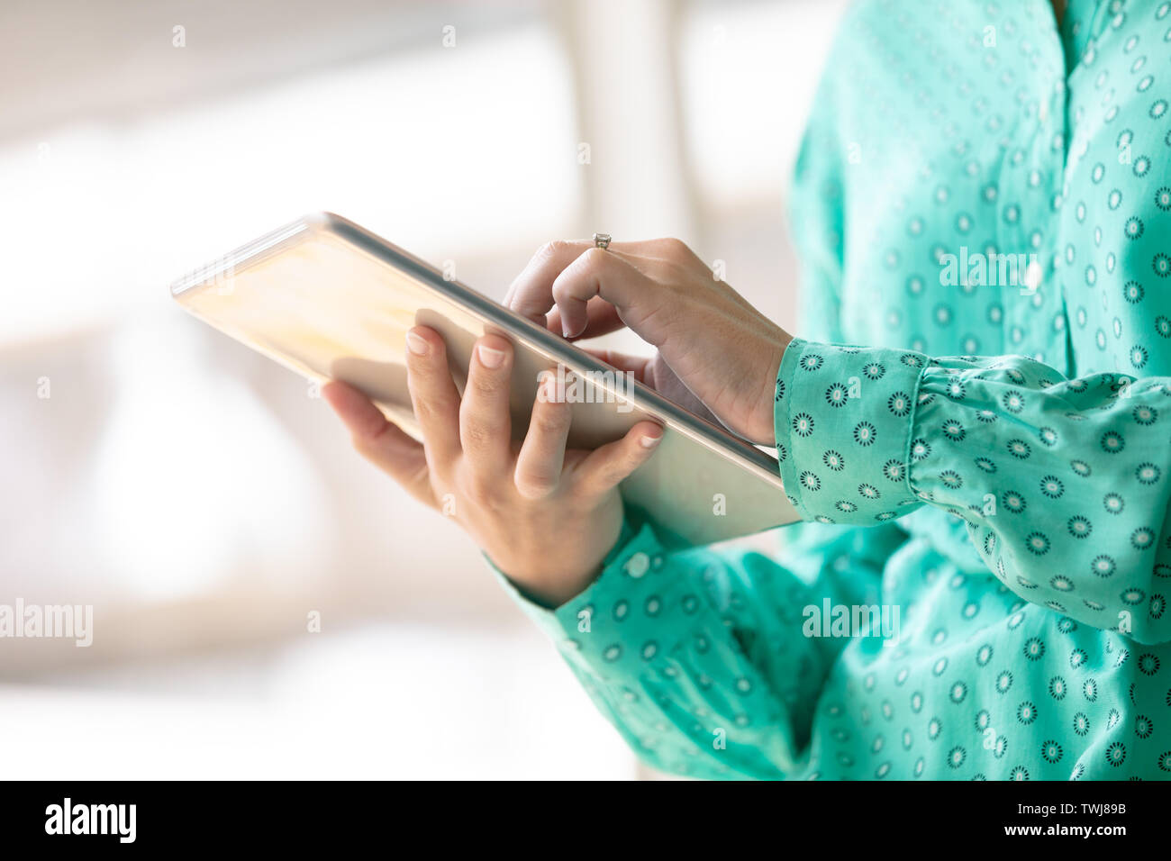 Businesswoman using digital tablet in office Stock Photo