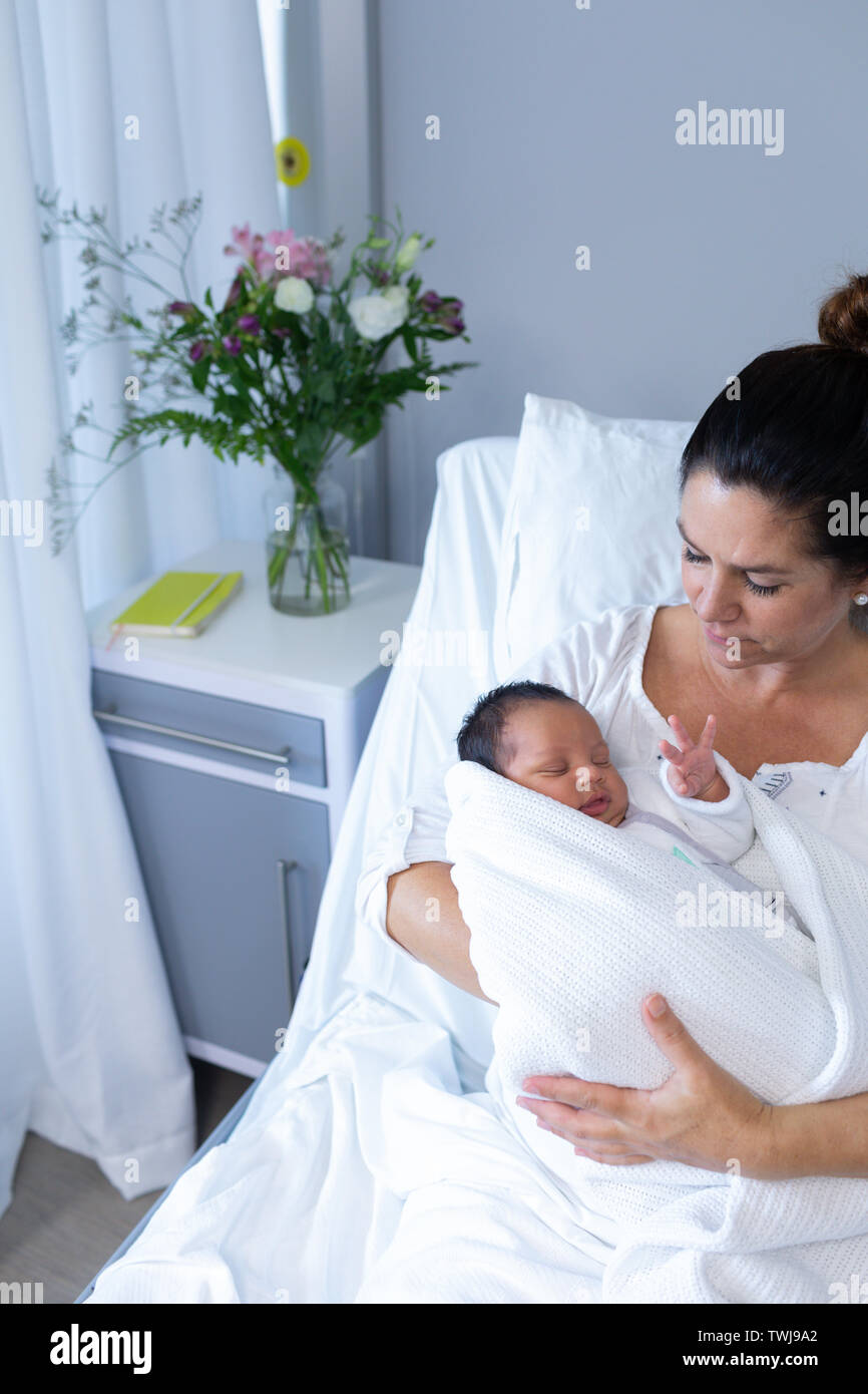 Mother holding newborn baby in hospital Stock Photo - Alamy