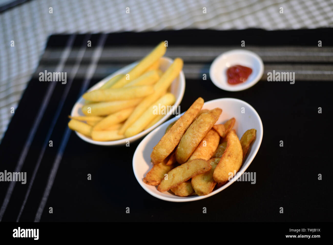 Chip And Gouges On Table Crispy potato chips and wedges, setup nicely on table ready to serve ...