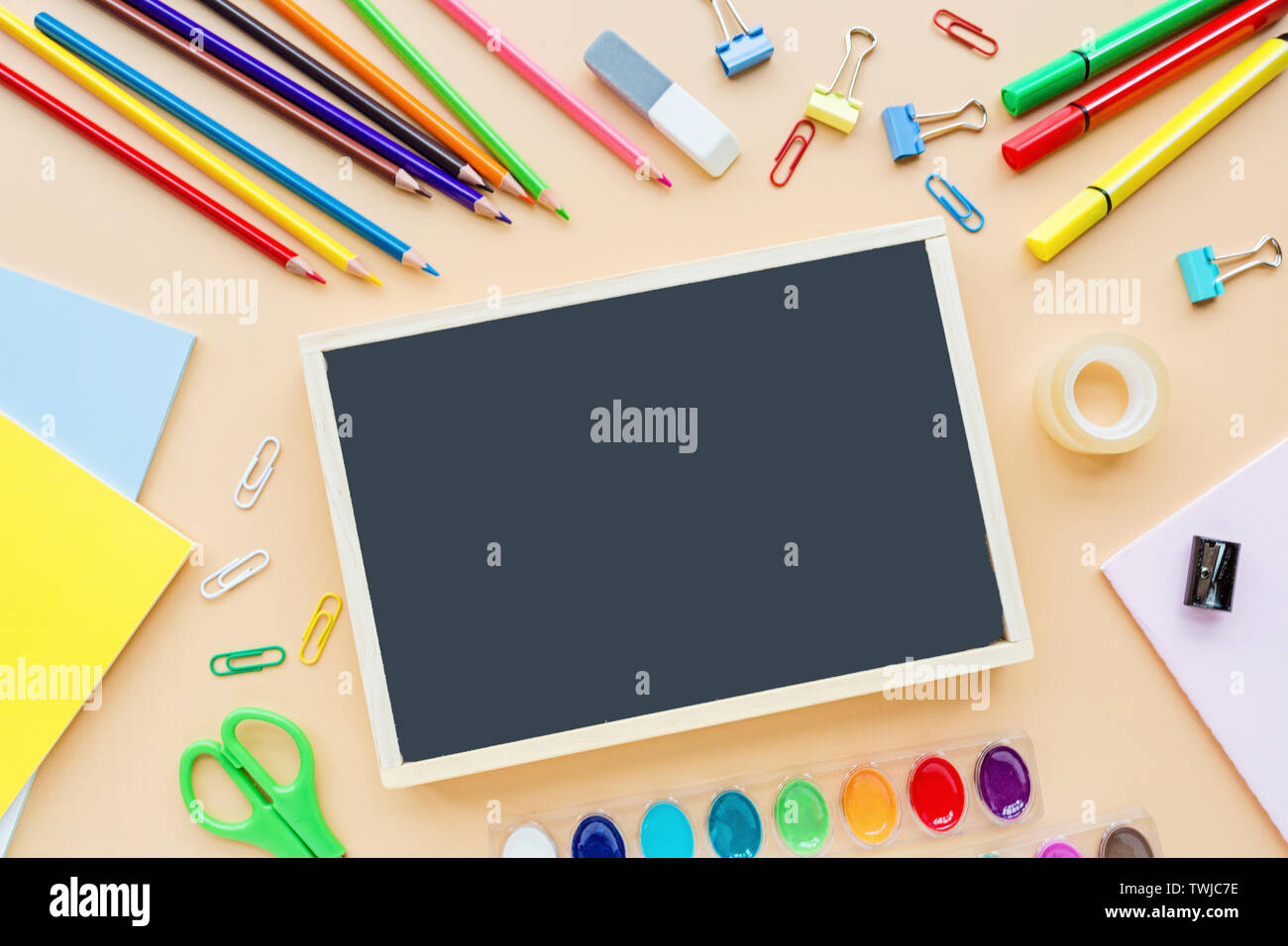 Orange back to school flat lay with bright stationery. School supplies ...
