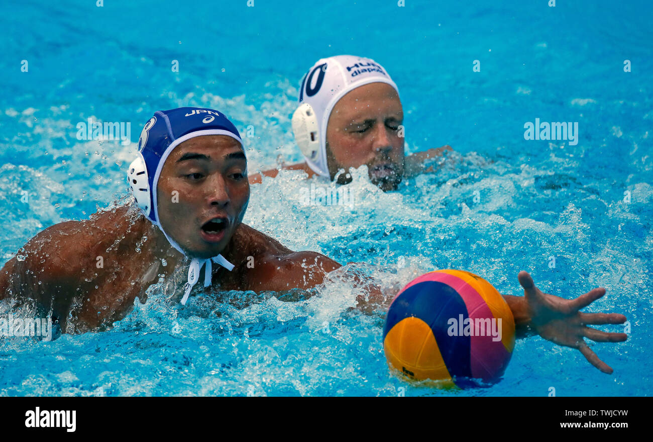 Belgrade, Serbia. 20th June, 2019. Japan's Mitsuru Takata (L) vies with  Hungary's Bence Batori (R) during FINA water polo superfinals group stage  match between Hungary and Japan in Belgrade, Serbia, on June