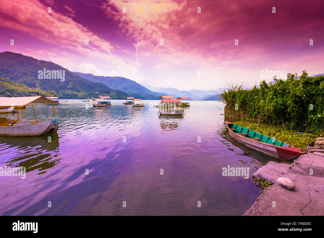 Colorful Pedal Boats Parked In Phewa Lake, blue hills and sunset ...