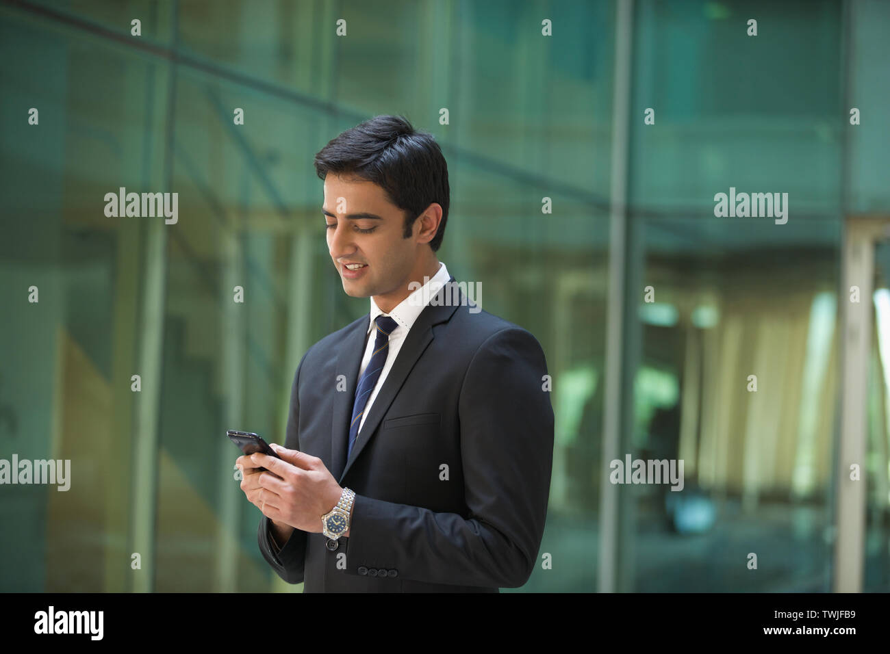 Receiving text message handsome hi-res stock photography and images - Alamy