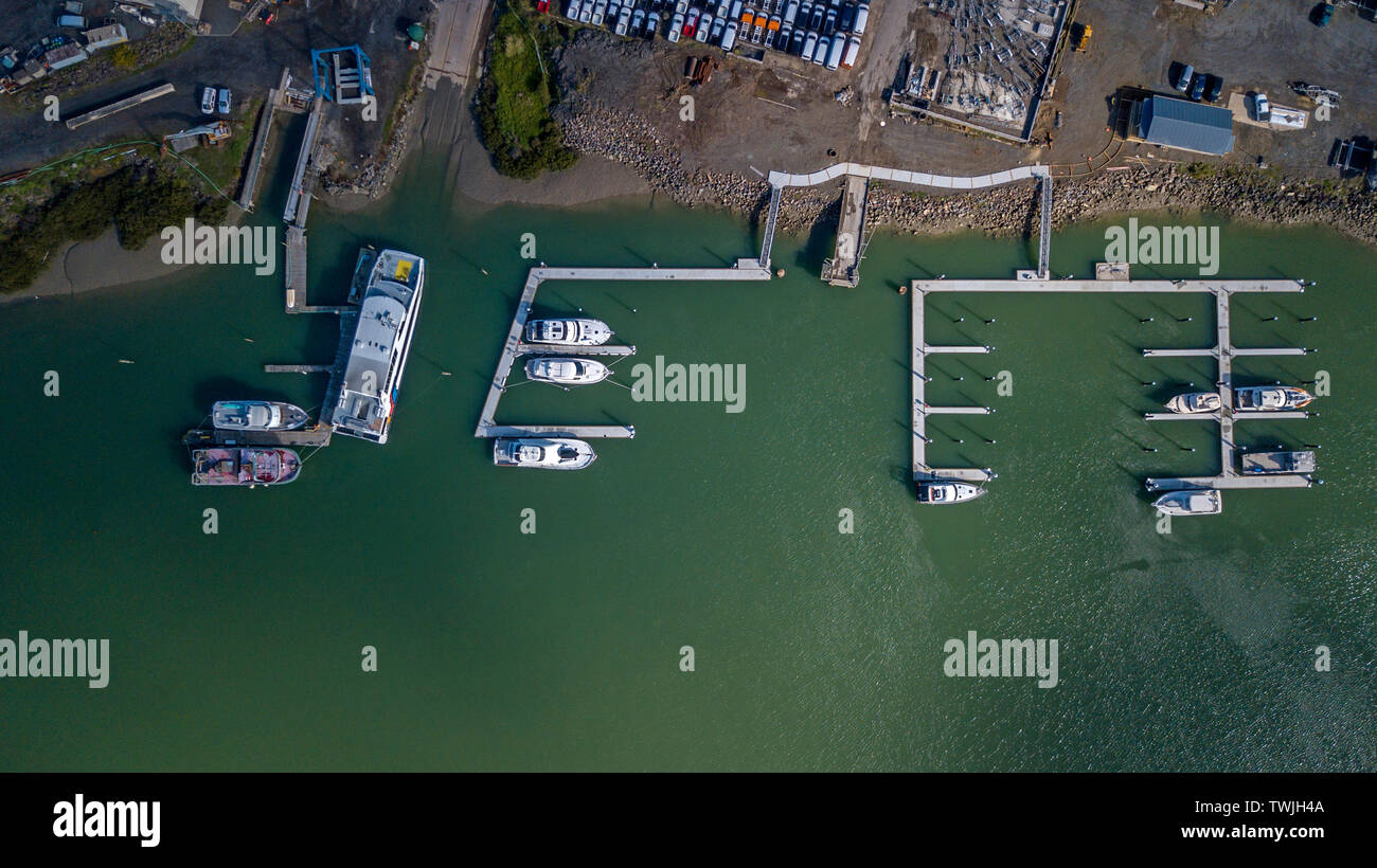 Aerial top view of marine next to a boat factory Stock Photo
