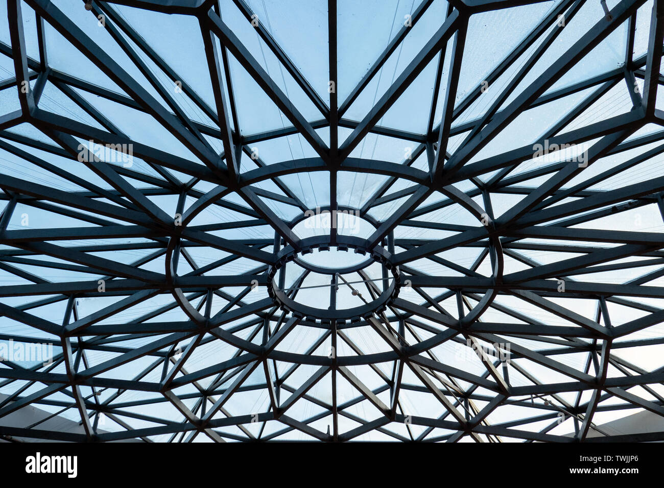 Metal roof shape of spider web covered with blue sky Stock Photo - Alamy