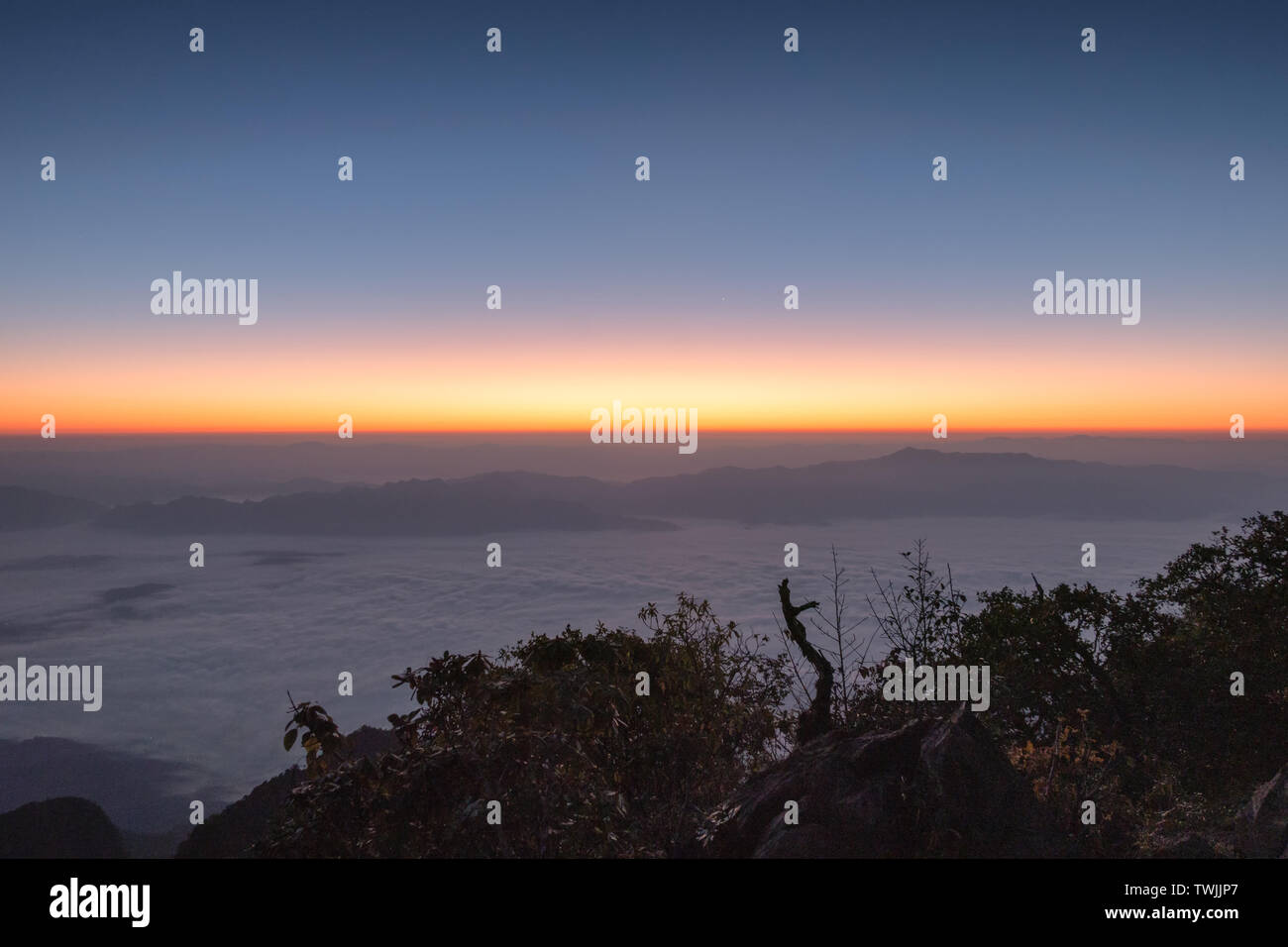 Landscape of Colorful sky with foggy on mountain at sunrise Stock Photo ...