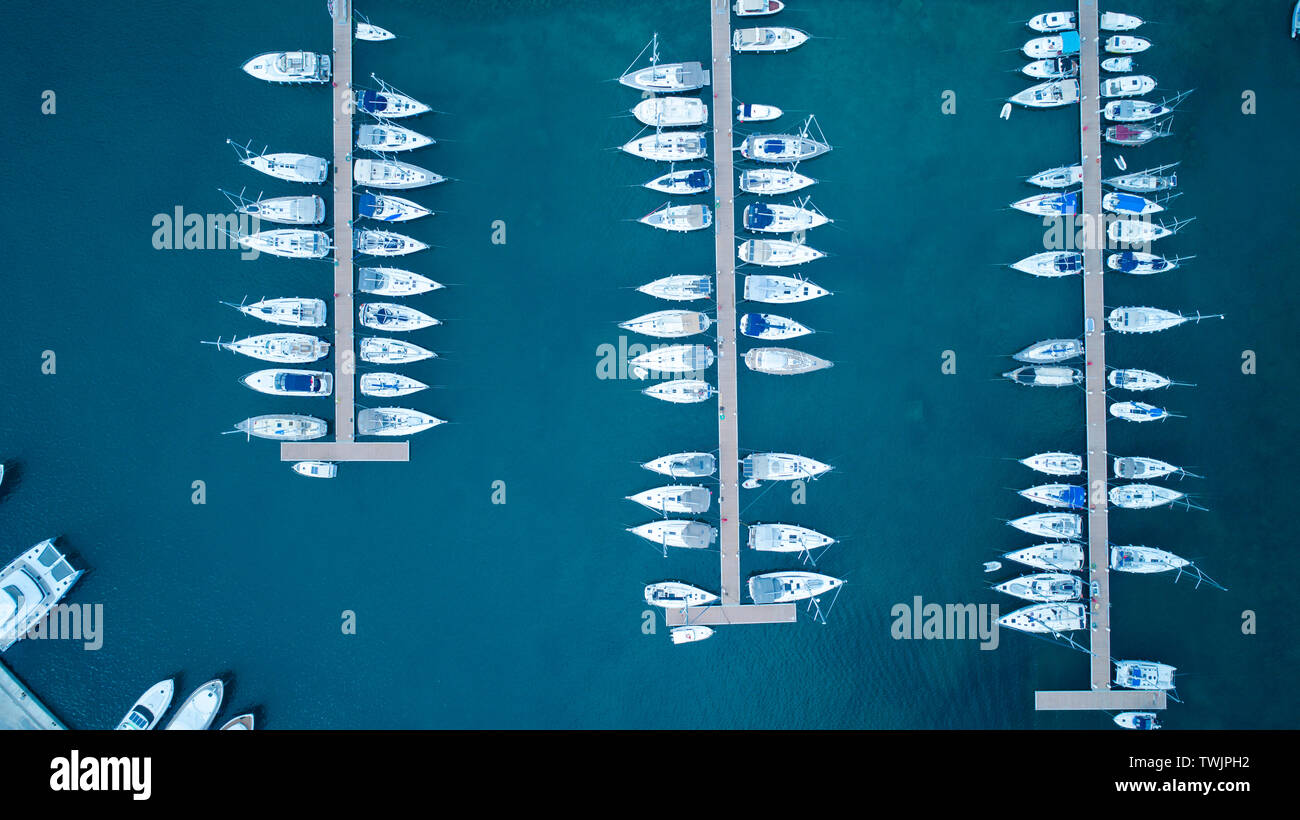 Aerial view of yachts and boat berthed in the marina and clear water. Aerial view of the Marina in Turkey. Holiday icons . Stock Photo
