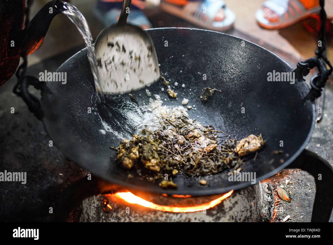 Guilin. 20th June, 2019. People make oleic tea in Xinzhai Village of ...