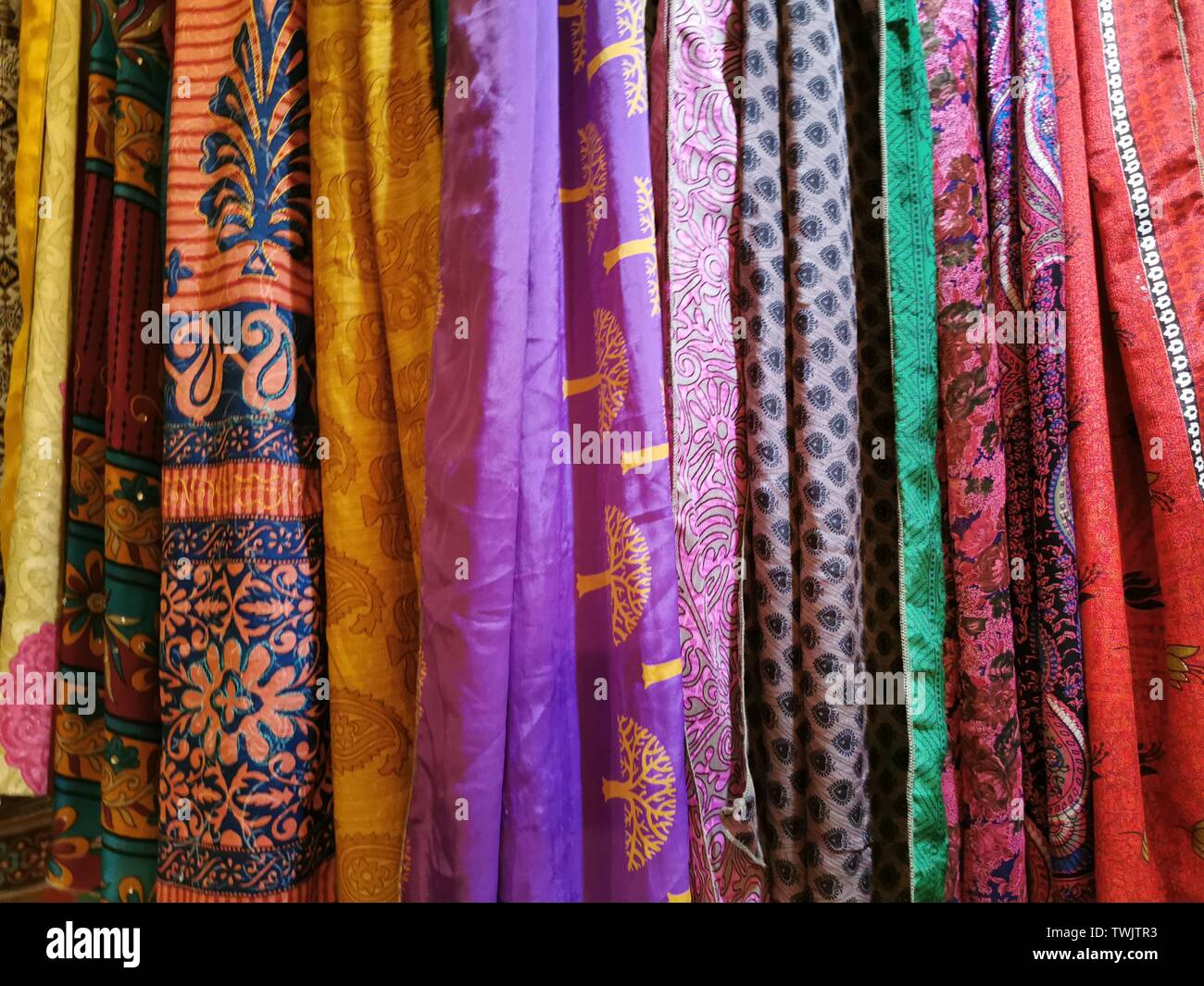 many colors indian fabric clothes at the market detail Stock Photo Alamy